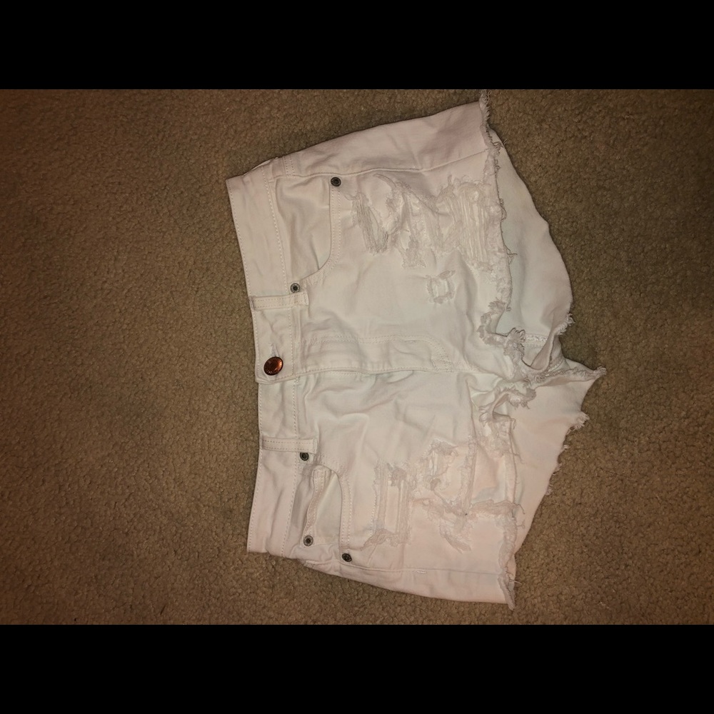 White ripped shorts